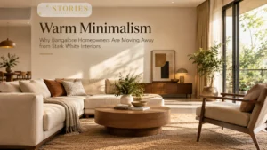 Warm minimalist interior design in a Bangalore home featuring earthy neutral tones, natural wood, soft lighting, and comfortable furnishings.